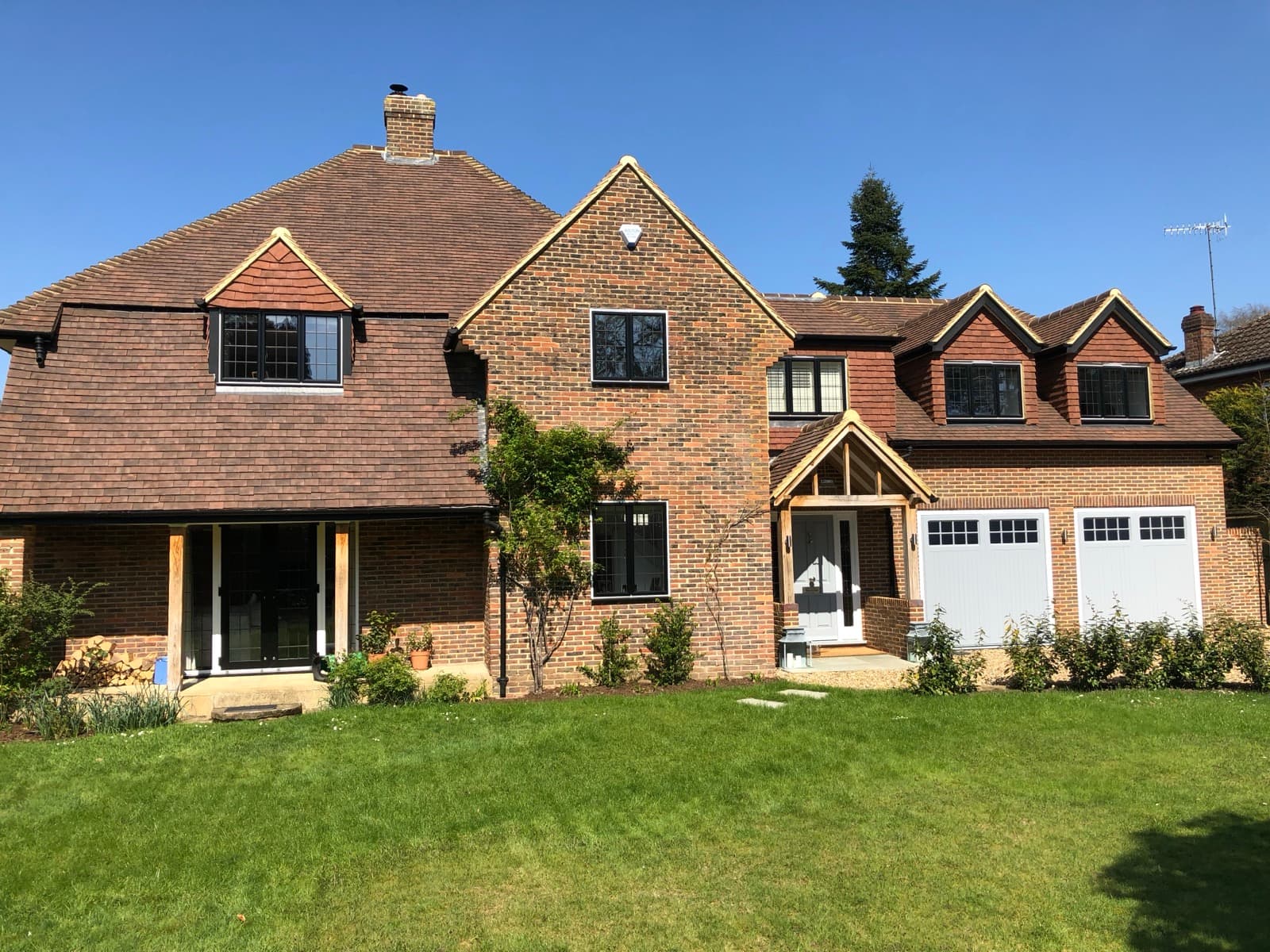 Rear of a brick house with a new two storey extension by Cooper Homes